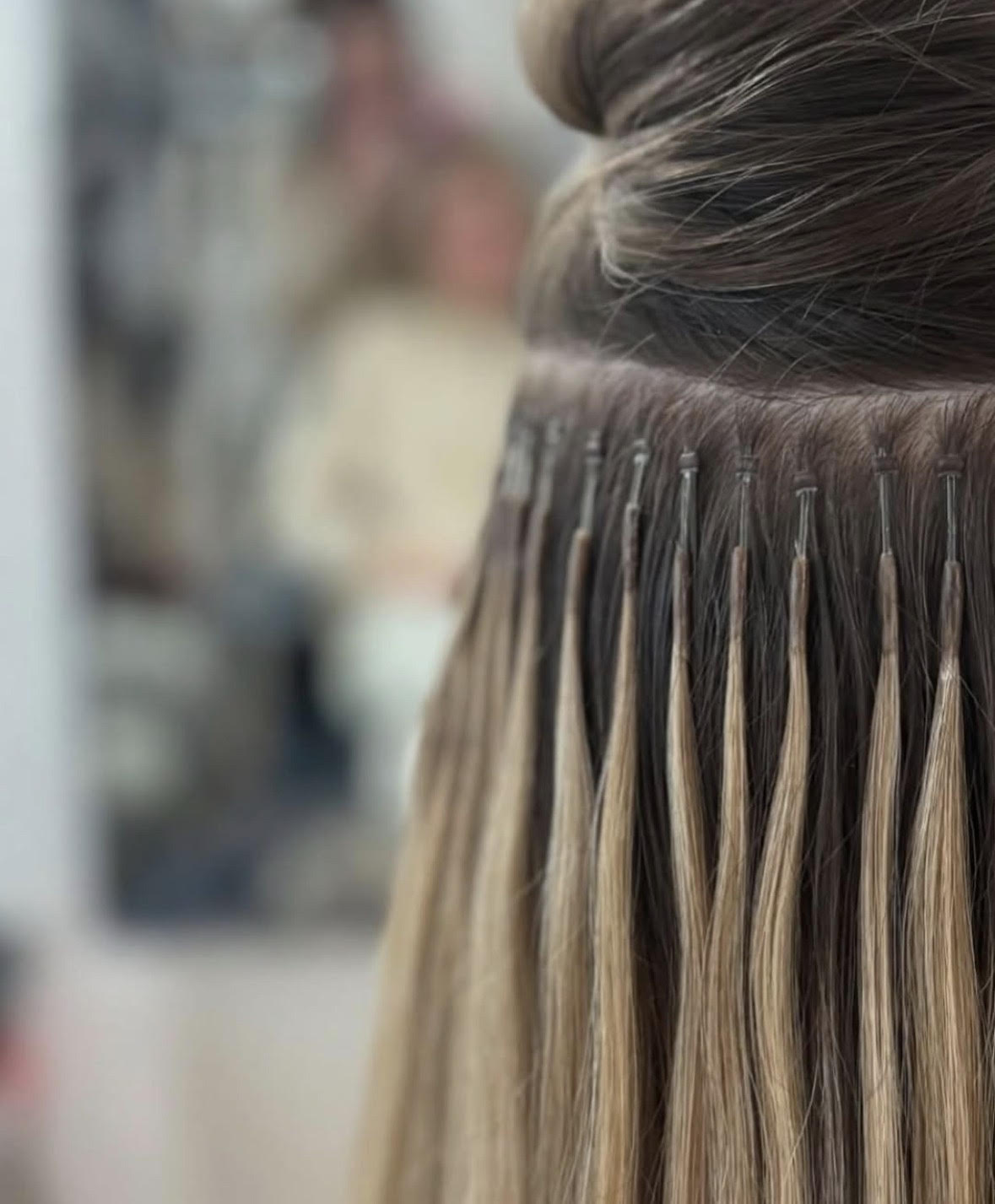Nano tip extension bonds laying flat against scalp